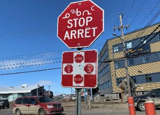 Stop sign printed in 3 languages